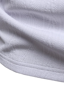 Detailed macro view of white pique knit fabric texture and high-quality double stitching