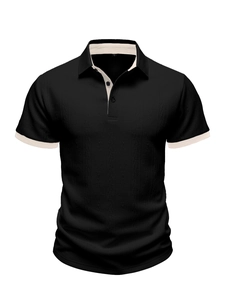 Detail of black knit polo shirt with beige contrast collar and 3D textured fabric