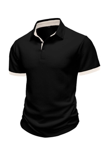 Close-up of black knit polo shirt with vertical texture and cream contrast collar detail