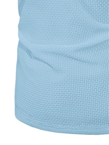 Close-up of light blue waffle weave fabric texture on breathable summer polo shirt