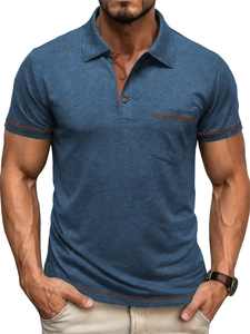 Close-up of indigo blue polo shirt featuring contrast brown trim on collar and pocket