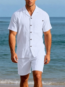 Detail of white linen blend summer set featuring textured fabric and retro button collar
