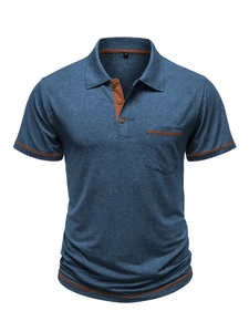 Detailed view of blue heather polo shirt with brown piping on pocket and collar edges