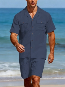 Detailed texture of navy linen summer set with Cuban collar and chest pockets