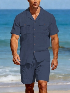 Close-up of dark blue men's linen short sleeve set with waffle texture and Cuban collar