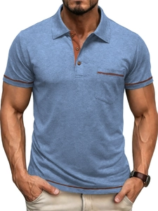 Detail of men's slim fit polo shirt with contrast orange trim on collar and pocket