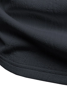 Macro detail of breathable navy knit fabric with premium double-stitched hem finish