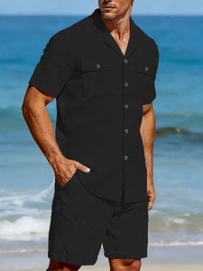 Close-up of black linen shirt with classic lapel collar and dual chest pockets
