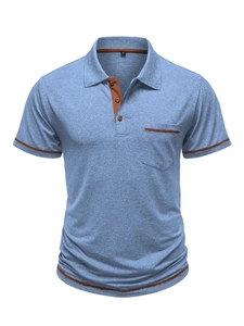 Close-up of light blue melange polo shirt showing brown collar lining and pocket details