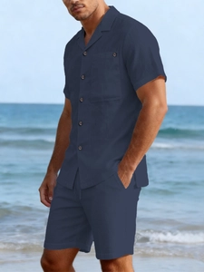 Close-up of dark blue linen shirt texture with Cuban collar and dark brown buttons