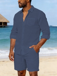 Detail of men's linen beach set featuring grey-blue long-sleeve shirt and matching shorts
