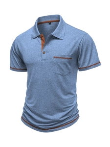 Detail of blue polo shirt with brown piping on collar and pocket with knit texture