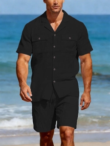 Men's casual black linen set showing button-down shirt with pockets and elastic shorts