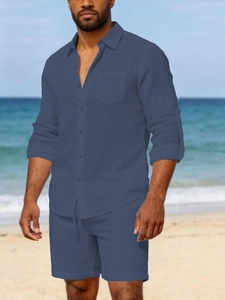 Close-up of men navy blue linen set featuring a button-down shirt and matching shorts