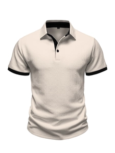 Detailed view of the diamond-textured knit fabric and black contrast collar of the polo shirt