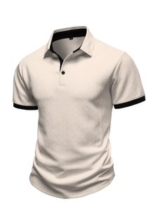 Detail of light beige polo shirt with geometric jacquard texture and black collar trim