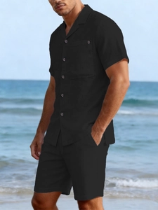 Close-up of lightweight black linen blend fabric texture on men's summer shirt and shorts