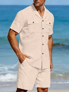 Close-up of beige linen two-piece set featuring short-sleeve shirt and matching shorts