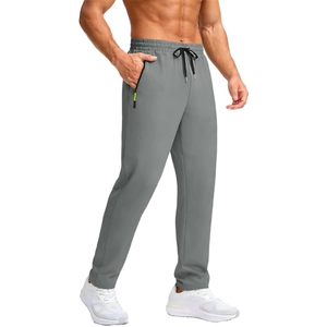 Detail of men's dark grey sport pants with elastic drawstring waist and zipper pockets