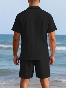 Detail of black waffle knit texture on men's casual beach shirt and shorts set