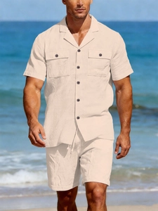 Close-up of beige linen two-piece resort set with Cuban collar and drawstring shorts
