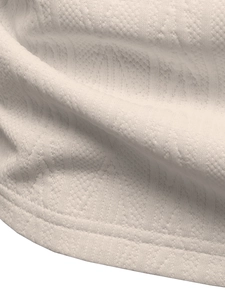 Macro shot of breathable honeycomb texture and durable hem stitching on knit polo shirt