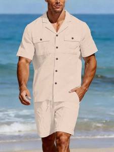 Detailed texture of men's beige linen shirt and drawstring shorts on a sunny beach