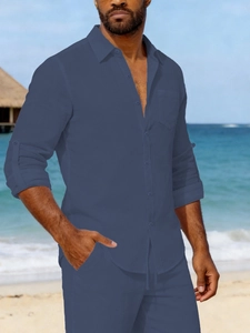 Men's dark blue linen shirt set featuring rolled sleeves and high-quality textured fabric