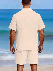 Detail view of men's beige seersucker linen set back view against a beach backdrop