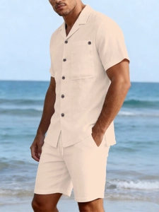 Close-up of lightweight beige linen texture on casual button-up shirt and drawstring shorts