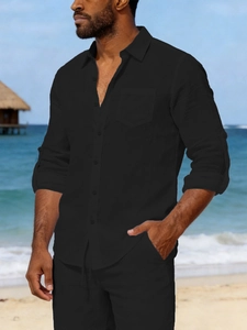 Detail of men's black linen shirt with adjustable sleeves for beach vacation wear
