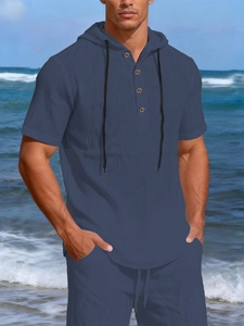 Close-up of deep blue linen-cotton hooded shirt with four buttons and drawstring detail