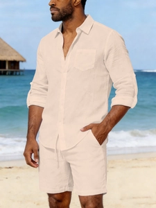 Detail of men's linen beach shirt showing chest pocket and adjustable roll-up sleeves