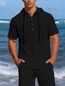 Detail of black linen short sleeve hoodie with wooden buttons and textured fabric
