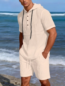 Detail of men's beige linen set featuring waffle texture fabric and hood drawstring