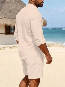 Detail view of men's beige linen set featuring buttoned cuffs and practical back pockets