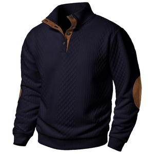 Detail of navy knit cardigan with brown suede elbow patches and textured stitch patterns