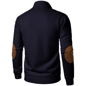 Detailed back view of navy cardigan featuring diamond quilted pattern and elbow patches