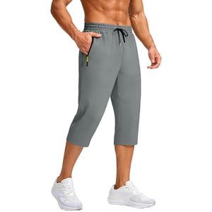 Detail view of men's quick-dry sports joggers featuring gray fabric and a zip pocket