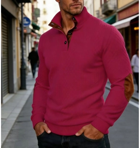Close-up of men's knit sweater with brown suede elbow patches and high button collar detail