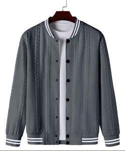 Close-up of men's bomber jacket with textured wave pattern and striped ribbed cuffs