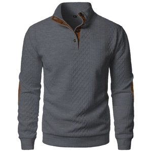 Detail view of brown faux suede elbow patches on dark grey knit pullover