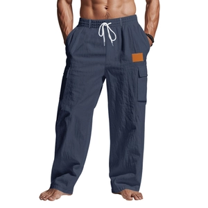 Détail du pantalon en coton et lin avec taille élastique et cordons de serrage blancs