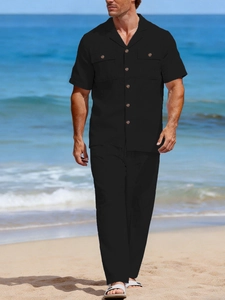 Detail of black linen resort set for men featuring Cuba collar shirt and breathable fabric