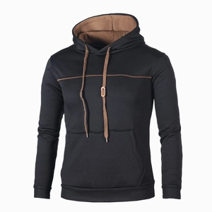 Detailed close-up of brown contrast hood lining and drawstring on black men's hoodie