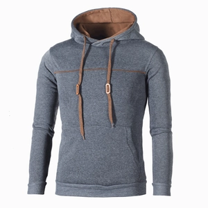 Detail of grey hoodie featuring contrast brown lining and kangaroo pocket design