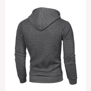 Detail van donkergrijze herenhoodie met jacquard textuur en geribbelde manchetten achter