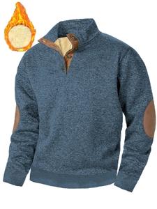 Close-up of blue textured pullover featuring warm fleece lining and stand collar detail