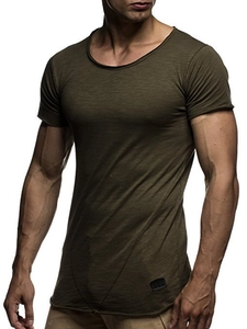 Detailed view of olive green slim fit T-shirt with raw edge hem and muscle fit on model