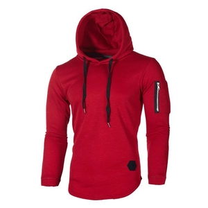 Detail of red hoodie showing the left sleeve zipper pocket and fabric texture